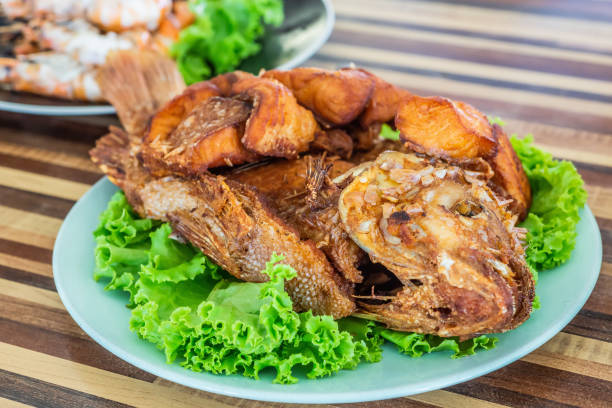 istock Fried fish with vegetable on dish. Local food in Thailand. 1328326527