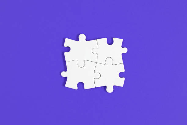 istock Four Puzzle Pieces Connected on Blue Background 1328327359
