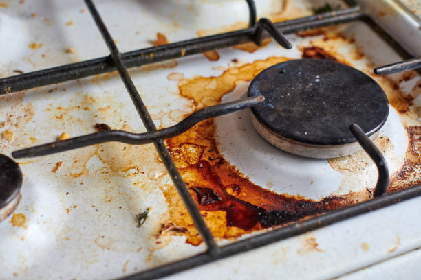 istock Dirty stove with food leftovers 1328328901