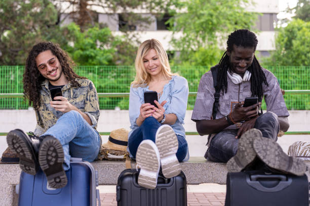 travellers waiting for departure, multiethnic group waiting to take the train, resumption of travel and tourism, rail transport, wanderlust concept