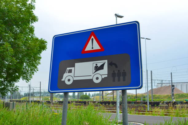 Zeebrugge, Belgium- July 11, 2021: industrial site Zeebrugge. Freight transport zone. New road sign board. It warns truckers to check the freight in their truck because there could be fugitives hiding to get overseas in the United Kingdom.