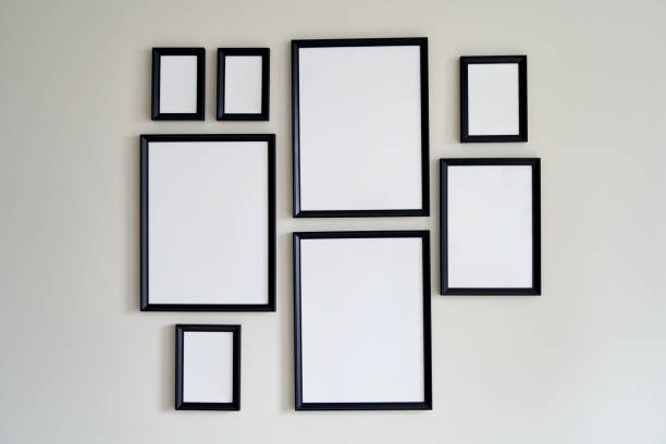 istock Different size framed photos hanging on the gray wall. Mockup 1328330777