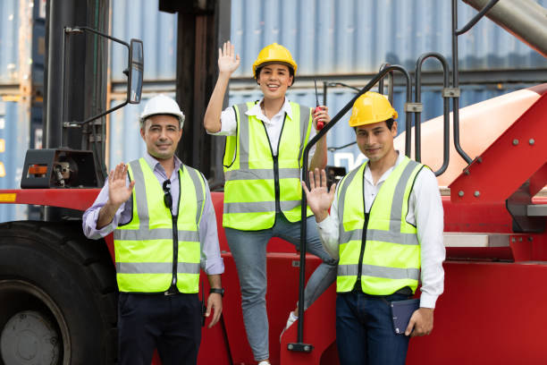 istock factory workers or engineer team raise hands pose for successful job in containers warehouse storage 1328330806
