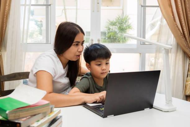 istock A mother is teaching her child from home schooling 1328331705