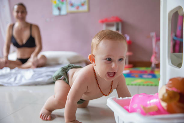 istock Mother Caring For a new Baby 1328333122