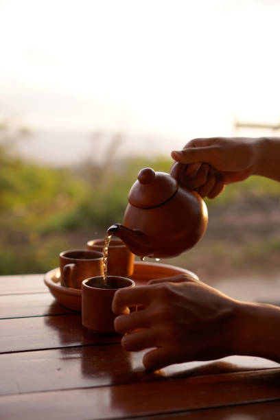 istock pouring tea into a glass in the afternoon 1328336009