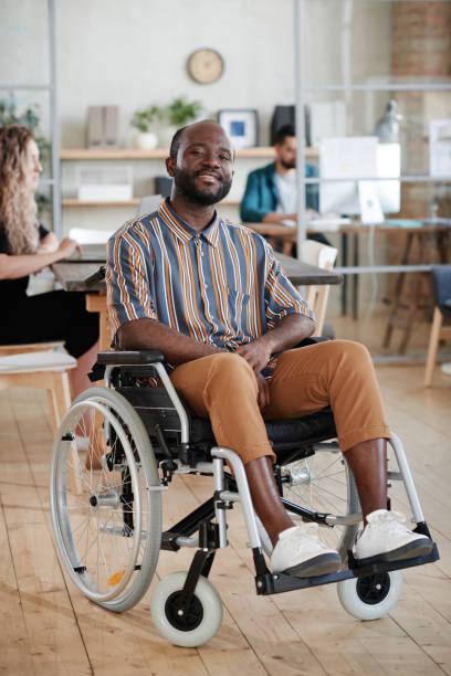 istock Disabled businessman sitting in wheelchair 1328336534