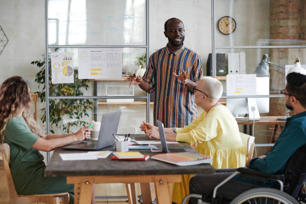 istock Businessman holding financial presentation at office 1328336773
