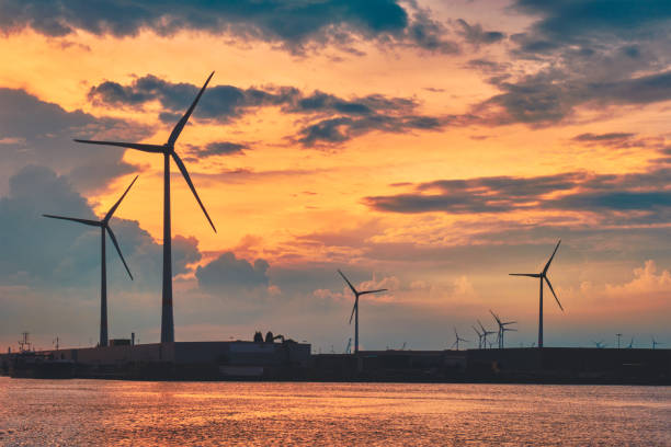 istock Wind turbines in Antwerp port on sunset. 1328339101