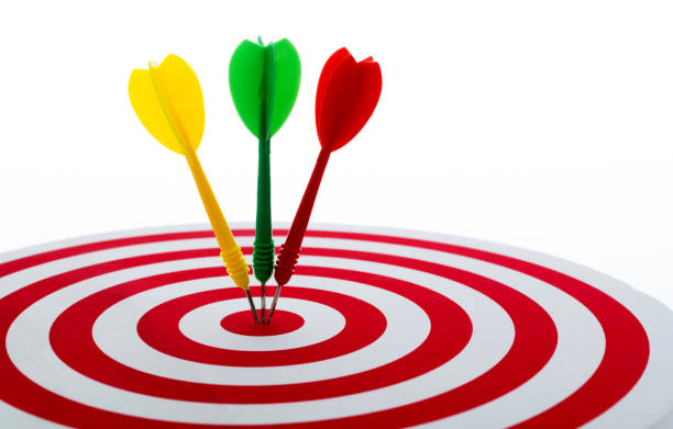 istock Dart arrows on center of dartboard 1328339664