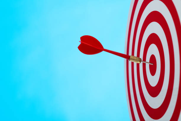 istock Dart arrow on center of dartboard 1328339685