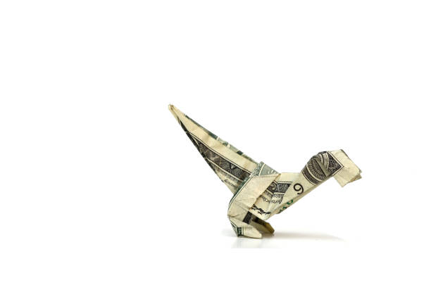 istock Origami dollar dinosaur (velociraptor) on white 1328341576