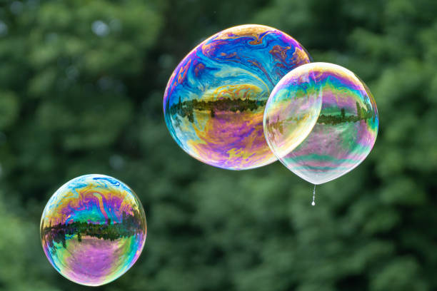 istock Releasing huge colorful soap bubbles in the open air 1328342578