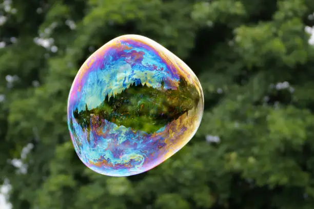 Photo of Releasing huge colorful soap bubbles in the open air