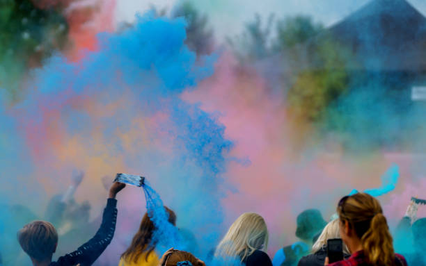 istock Colorful powder thrown into the air by the crowd 1328342600
