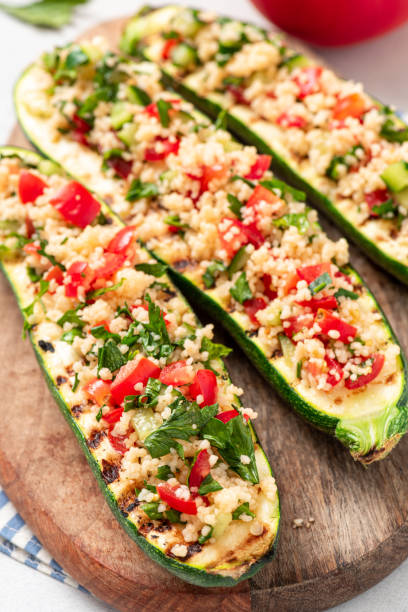 istock Grilled zucchini stuffed with couscous and vegetables 1328342919