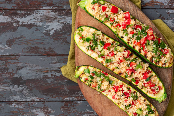 istock Grilled zucchini stuffed with couscous and vegetables 1328342930