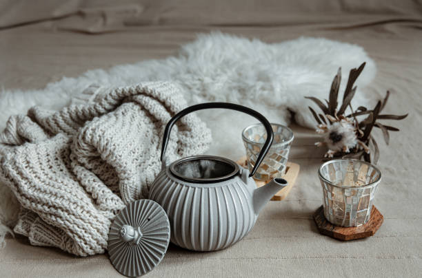 istock Cozy home composition with teapot and home decor details. 1328343270
