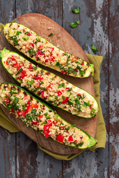 istock Grilled zucchini stuffed with couscous and vegetables 1328344165