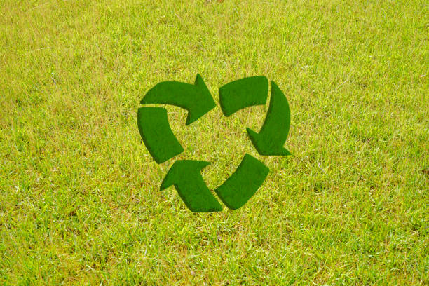 Recycle Symbol A heart shaped recycle symbol on the grass. climate justice photos stock pictures, royalty-free photos & images