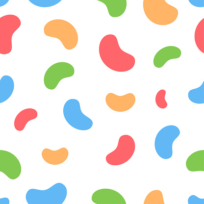 Seamless pattern with colored jelly beans on a white background.