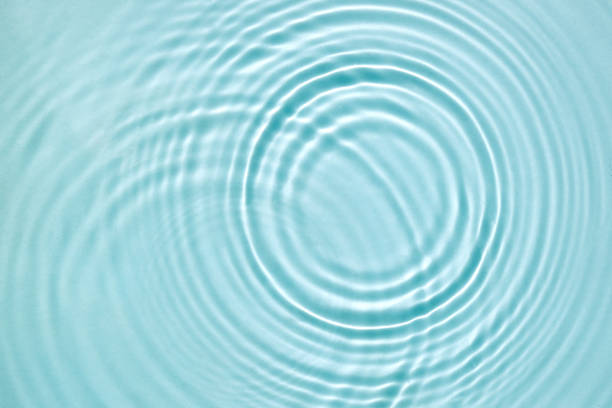 istock Blue water texture, blue mint water surface with rings and ripples. Spa concept background. Flat lay, copy space. 1328350617