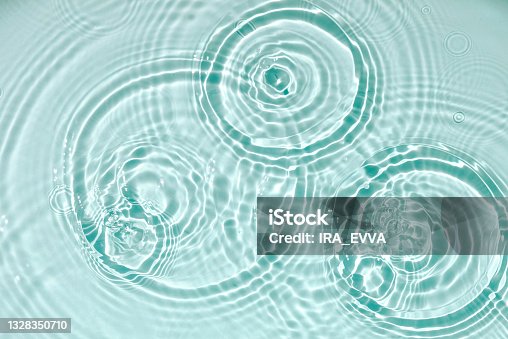 istock Blue water texture, blue mint water surface with rings and ripples. Spa concept background. Flat lay, copy space. 1328350710