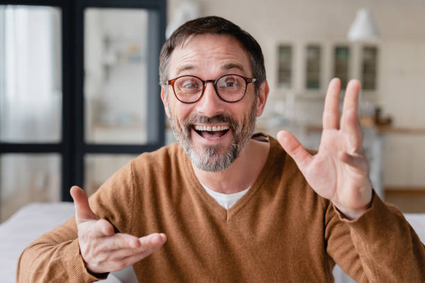istock Online tutoring, teaching, remote distant work. Mature businessman freelancer father on video call conversation conference meeting, front view. 1328351528