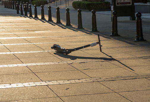 Nashville, Tennessee - 28 June 2021: Bird electric scooter abandoned on Pedestrian bridge near Broadway and downtown entertainment