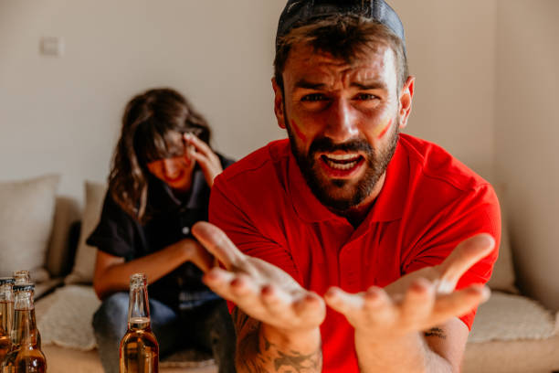 istock Football fan on knees 1328358873