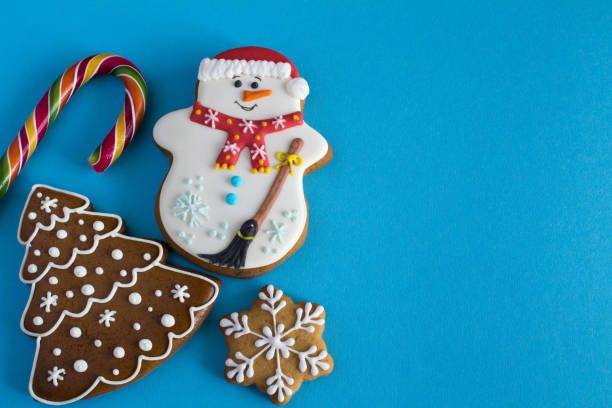 Christmas cookies on the blue  background. Top view. Copy space.