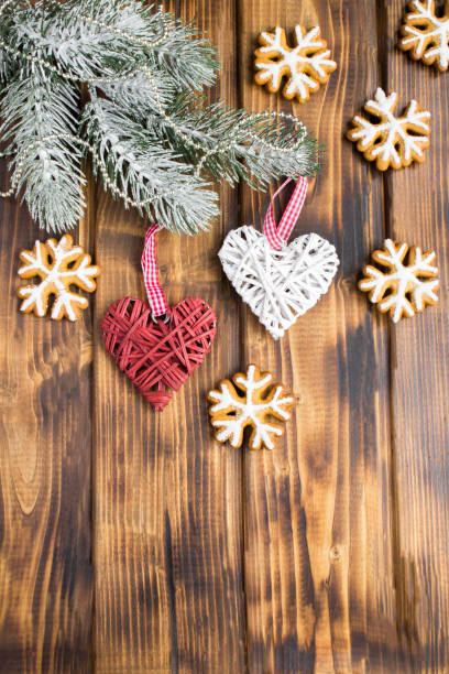istock Christmas  composition with gingerbread and decorative hearts on the  wooden  background 1328360153