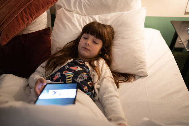 istock Exhausted girl sleeping using digital tablet at home 1328360205