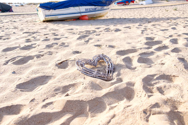 istock decorative heart made of hurdle in beach sand 1328360526
