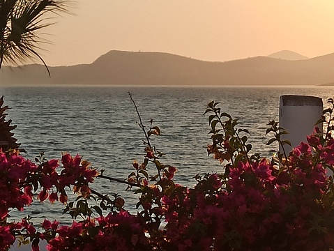Traditional turkish summer houses during sunset at bodrum coast of aegean sea in turkey