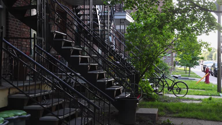 Classical Montreal Rosemont iron exterior staircases with parked bicycles