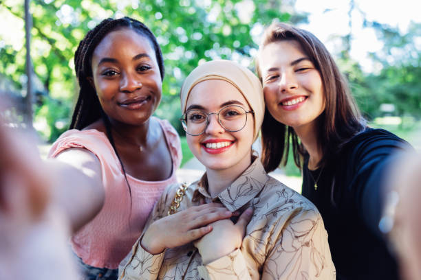 istock Group portrait of millennials smiling at the camera 1328367192