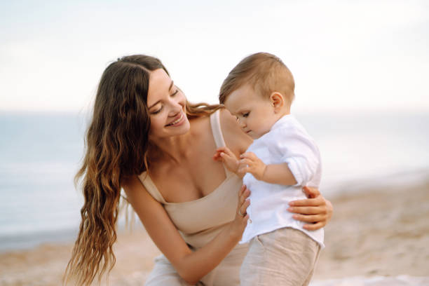 istock Mother with a child have fun outdoors playing games love each other. 1328367270
