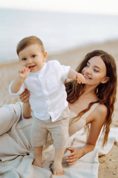 istock Mother with a child have fun outdoors playing games love each other. 1328367331