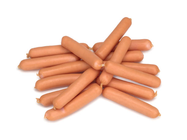 istock Fresh sausages isolated on white background, top view. 1328368505