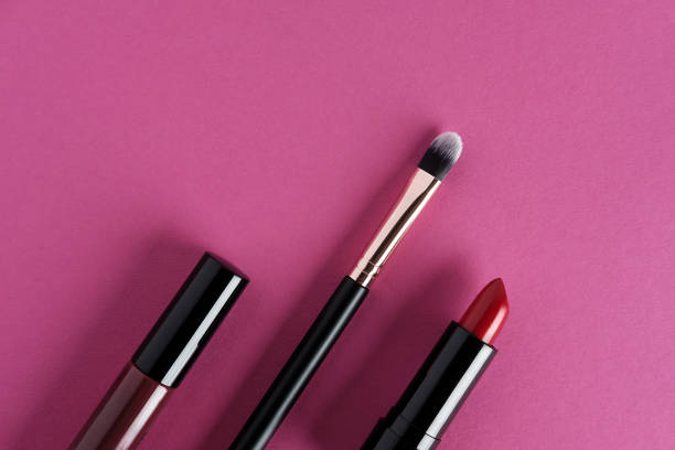 istock Set of makeup cosmetics on pink background. 1328368702