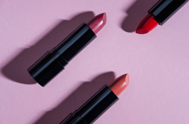 istock Set of lipsticks on light pink background. 1328368717