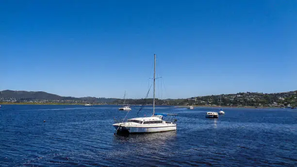 view to a river with boats in south africa at summer