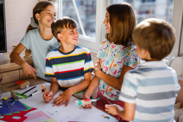 istock Children making DIY toys from paper 1328371259