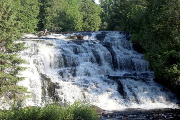istock River Waterfalls Flowing Down the Rocky Rapids 1328371961