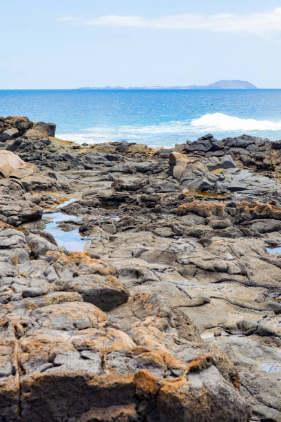 istock Punta Pechiguera, Lanzarote, views towards Isla de Lobo. 1328374405