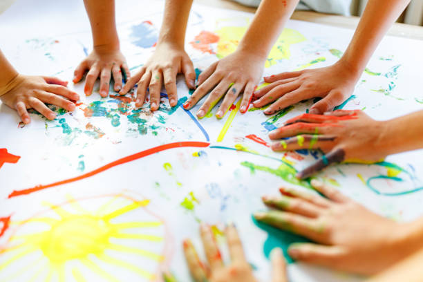 istock Group of children having fun playing whit colors 1328374614