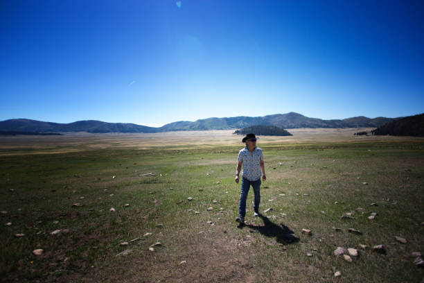istock Man Walking in Valles Caldera Wilderness, New Mexico 1328382195