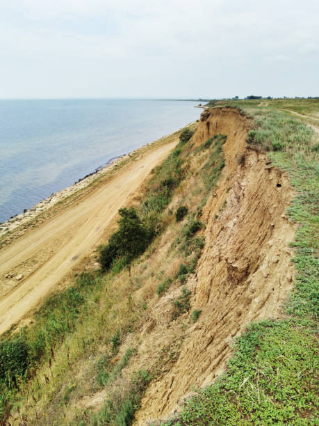istock A steep cliff at the seashore, a road along the coast. 1328385773
