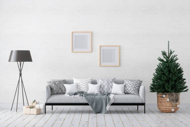 istock Living Room Interior With Empty Picture Frames On The Wall, Christmas Tree, Ornaments, Gift Boxes And The Gray Sofa 1328388627